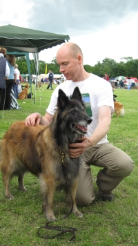 Photo of Will performing a dog spine check on Kyte